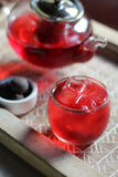 Hibiscus Mint Tea served in a beautiful glass teapot. Oribe Tea from Hawaii makes the most delicious Hibiscus Tea anywhere in the U.S.